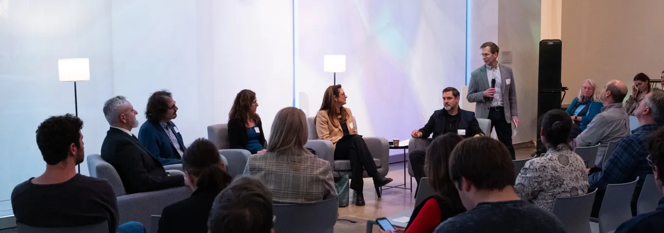 "panelists and crowd"